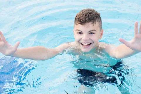 Happy boy in pool Stock Photos