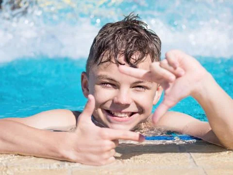 Happy boy in pool Stock Photos