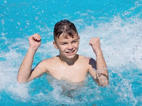 Happy boy in pool Stock Photos