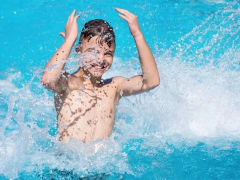 Happy boy in pool Stock Photos