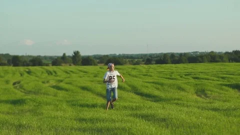 Happy Boy Running On Field Video stock 78674265