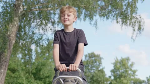 A Happy Boy on a Seesaw Slow Motion 库存影片 346370772