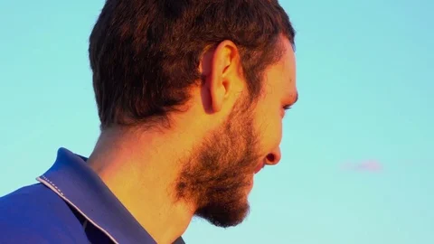 Happy Boy smiles at Camera, Orange light Sunset Video stock 69743960