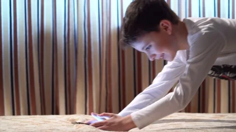 Happy Boy On Sofa Playing With Digital Tablet Stock Footage 58887841