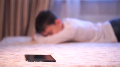 Happy Boy On Sofa Playing With Digital Tablet in Slow Motion Stock Footage 58887905