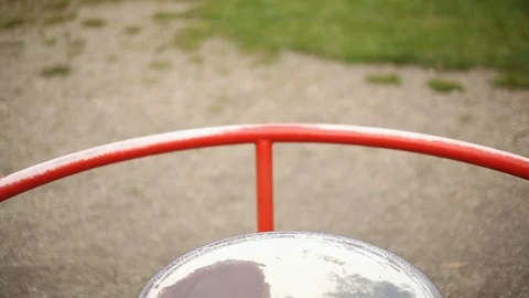 Happy boy spinning on carousel on the playground and having fun Stock Footage 75215899