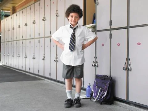 Happy Boy Standing By School Lockers Stock Photos