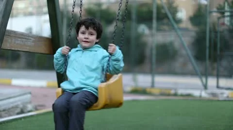 Happy boy on a swing Stock Footage 22009895