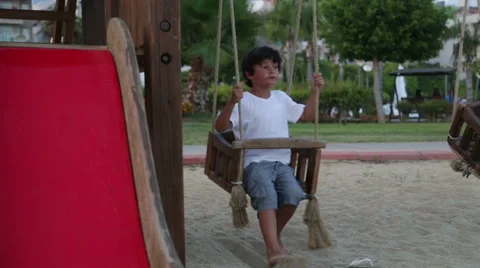 Happy boy swinging Stock Footage 40053163