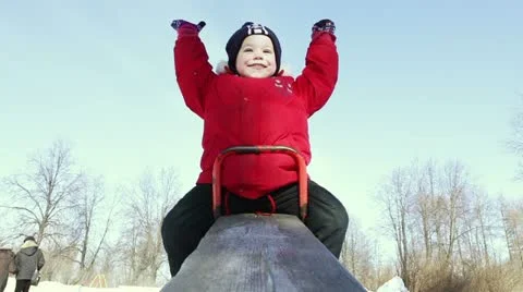 Happy boy on a teeter Stock Footage 10835489