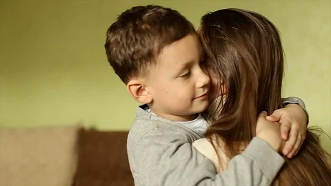 The happy boy tenderly embraced his mother Vídeos de archivo 74699409
