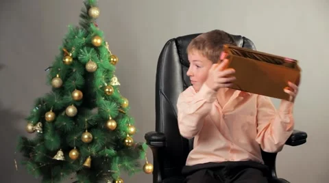 Happy Boy Unpacking Present Box On Christmas Stock-Footage 57100855