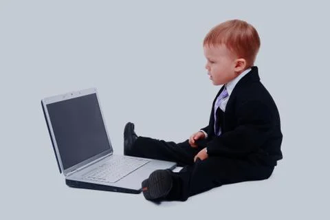 Happy boy using laptop computer. Foto stock