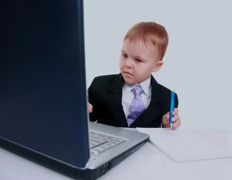 Happy boy using laptop computer Foto stock