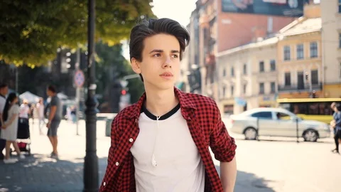 Happy boy using mobile phone smiling walk in city guy business fashion hand Stock Footage 92051207