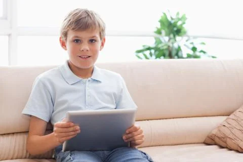 Happy boy using tablet computer 스톡 사진