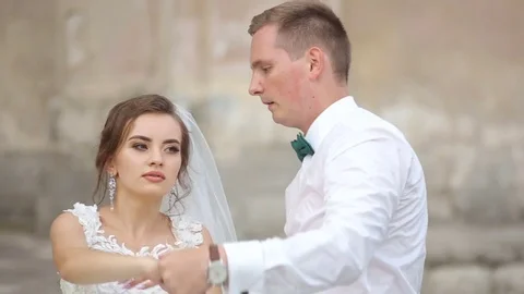 Happy bride and groom dancing on a street Stock Footage 85360906