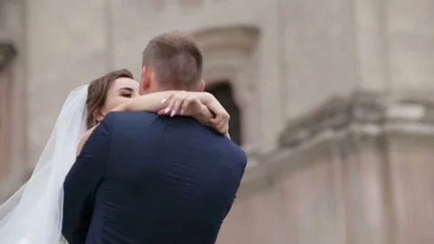 Happy bride and groom dancing on a street Stock Footage 85480282
