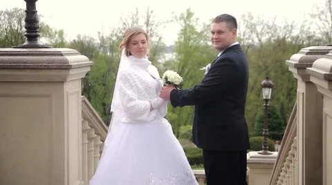 Happy bride and groom posing Stock Footage 62435554
