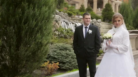 Happy bride and groom posing Stock Footage 62437502
