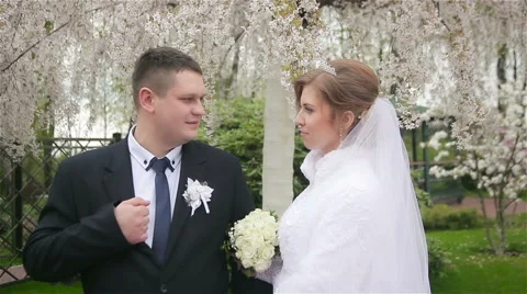 Happy bride and groom posing Stock Footage 62438048