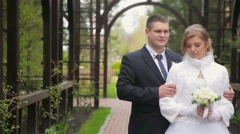 Happy bride and groom posing Stock Footage 62438159