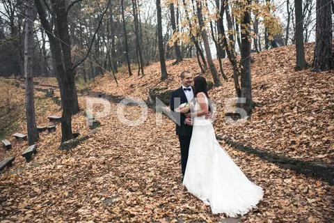 Happy bride and groom posing Stock Photos