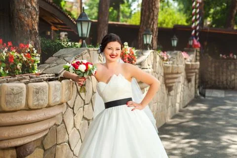 Happy bride in front of cafe Stock Photos