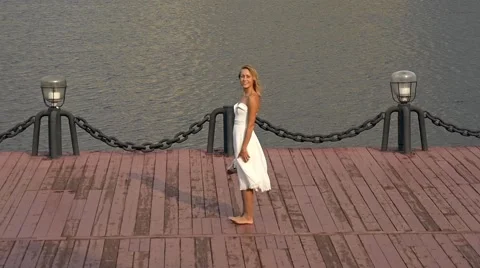 Happy bride twisting in dance on pier Stock Footage 66953422