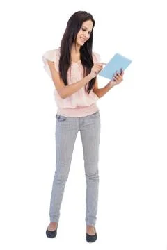Happy brunette using tablet pc Foto stock