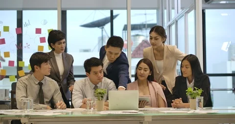 Happy business team looking at computer, Pleased with their success Stock Footage 113062461