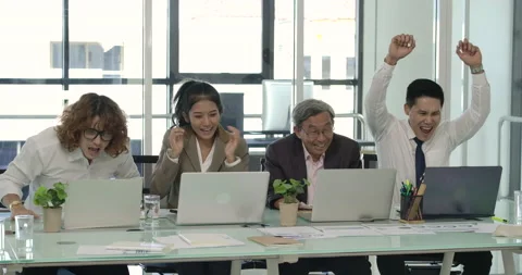 Happy business team looking at computer, Pleased with their success Stock Footage 152879410
