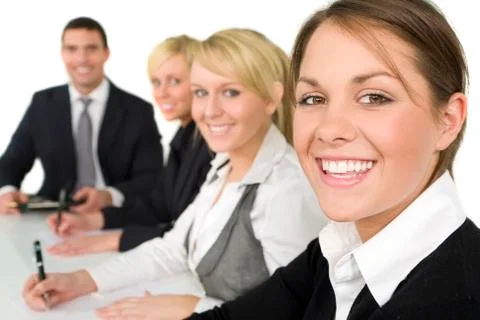 Happy business team man and three women in a meeting Stock Photos