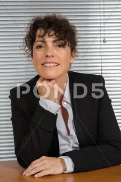 Happy business woman smiling at office Stock Photos