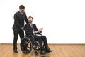 The happy businessman and the invalid hold papers on the white wall backgroun Photo