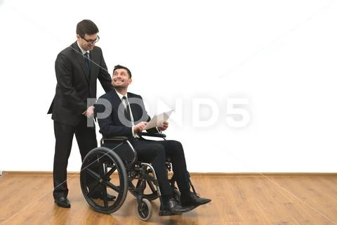 The happy businessman and the invalid hold papers on the white wall backgroun Stock Photos