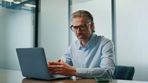 Happy businessman computer videocalling cabinet close up. Smiling boss talking Video stock 237343613