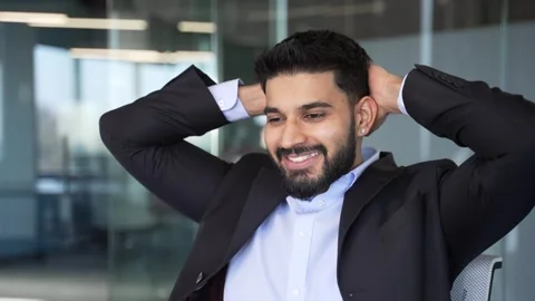 Happy businessman finished work on task sitting at workplace in business office. Stock Footage 334861891