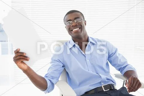 Happy businessman holding a page Stock Photos
