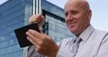 Happy Businessman Manifests Enthusiastic When Read News on Touch Tablet Screen 4k or 4k+ Resolution