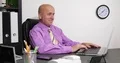 Happy Businessman in Office Smile Reading Good News on Laptop Screen 4k or 4k+ Resolution