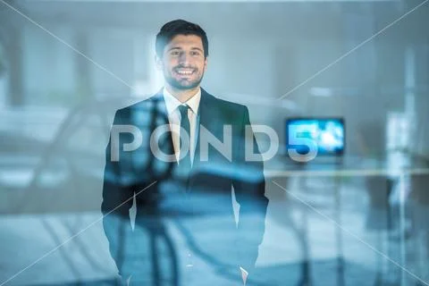 The happy businessman stand near the window Stock Photos