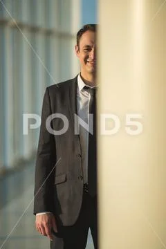 The happy businessman stand over the column Stock Photos