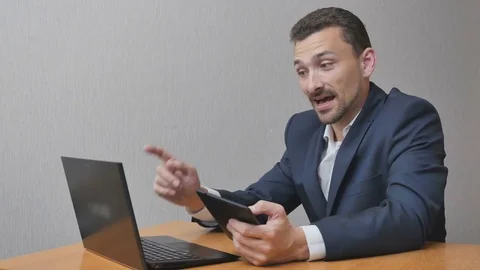 Happy businessman talking online and use tablet Stock Footage 78386853
