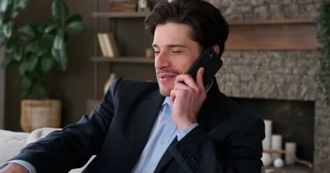 Happy businessman talking using mobile phone Stock Footage 239454406