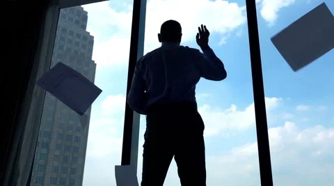 Happy businessman throwing document while standing by the window, super slow mot Stock Footage 60725489