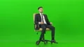 The happy businessman turning on the office chair on the green background 4k or 4k+ Resolution