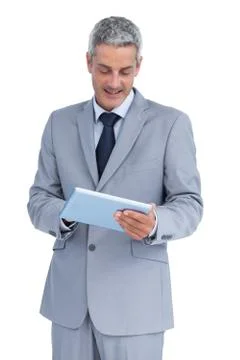 Happy businessman using tablet pc Foto stock