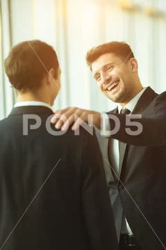 The happy businessmen pat on the shoulder Stock Photos