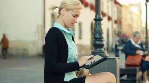 Happy businesswoman with digital tablet in the city, steadicam shot Stock Footage